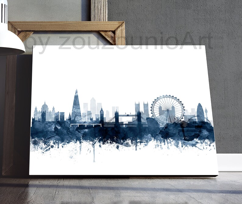May include: A watercolor painting of the London skyline in shades of blue. The skyline includes the London Eye, Big Ben, and other iconic landmarks. The painting has a white background.