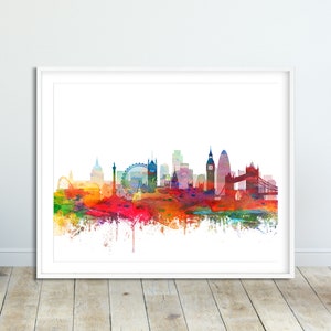 Puede incluir: Una pintura de acuarela del horizonte de Londres, que presenta monumentos emblem&aacute;ticos como el Big Ben, el London Eye y el Tower Bridge. La ciudad se representa en colores vibrantes, con salpicaduras de rojo, naranja, amarillo, verde, azul y morado.
