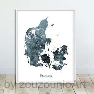 May include: A watercolor print of a map of Denmark in shades of blue and gray. The map is outlined in white and the word "DENMARK" is printed in black at the bottom of the print.