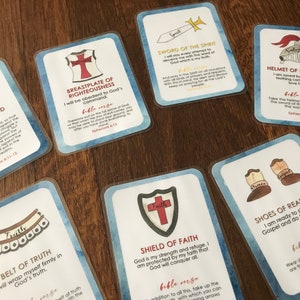 May include: A set of 10 colorful cards with illustrations of armor and weapons. Each card has a title, a bible verse, and a description of the armor piece. The cards are designed to help people understand the spiritual armor of God.