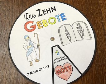 May include: A colorful wheel with the text "Die Zehn Gebote" (The Ten Commandments) in German. The wheel has a picture of Moses holding a staff, two stone tablets with Roman numerals, and a heart with the word "Gott" (God) in German.