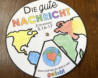 May include: A colorful paper wheel with a world map and the text "Die gute Nachricht" (The good news) in German. The wheel also includes the text "Johannes 3,16-17" and "Denn Gott hat die Welt so sehr geliebt" (For God so loved the world).
