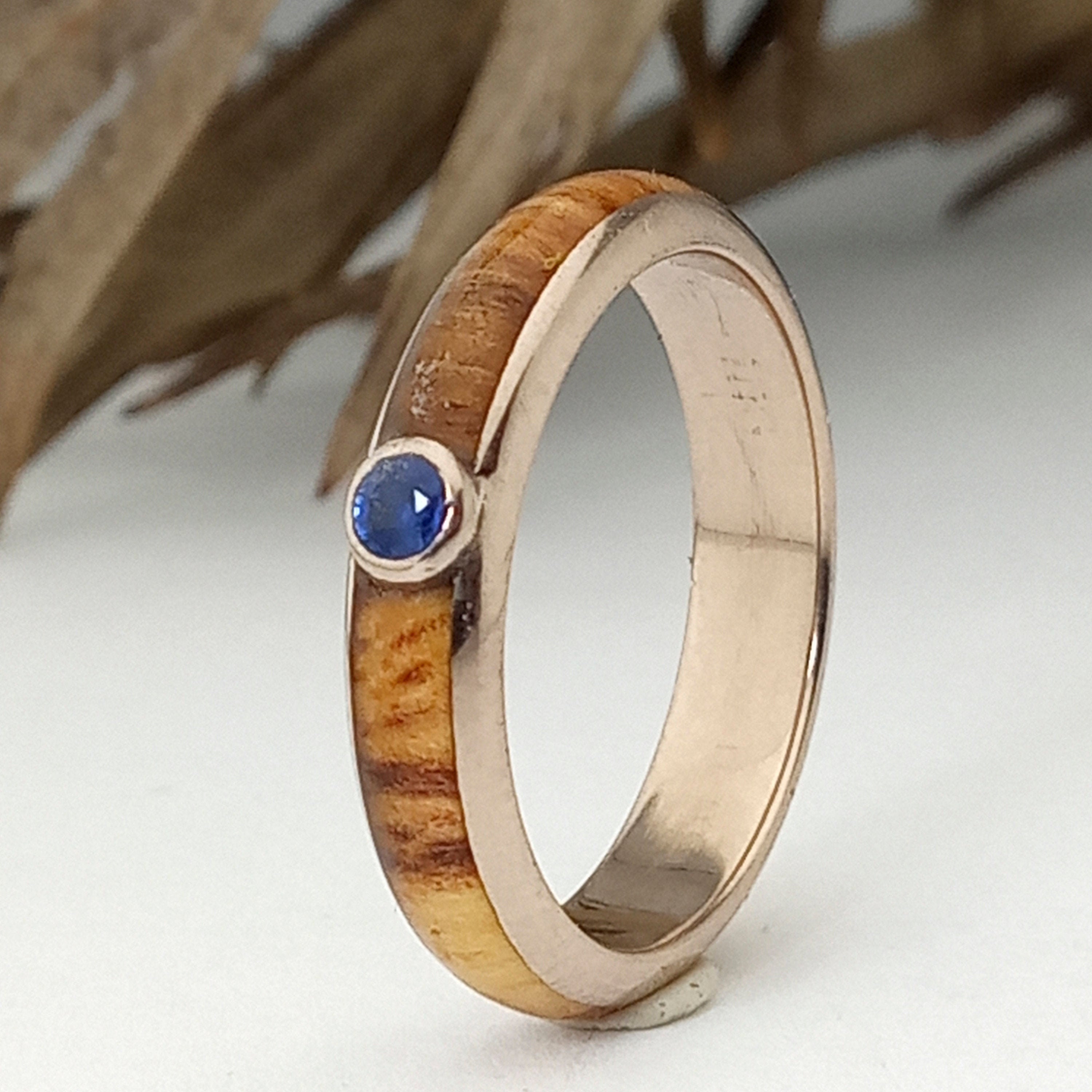 Wood and sapphire ring sales