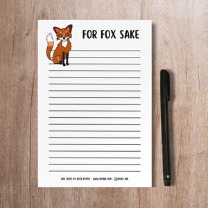 May include: A white lined notepad with a cartoon fox illustration and the text "FOR FOX SAKE". The notepad has a black and white striped border and the text "BAD JOKES BY GOOD PEOPLE - WWW.SKPHK.COM - @SKP_JNK" at the bottom.