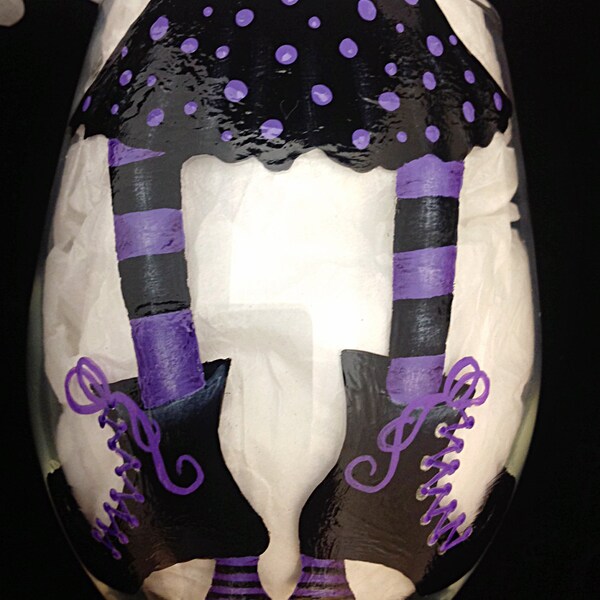 HALLOWEEN WINE GLASS, witch legs are always fun. Purple socks and laces on her shoes. Black with purple polka dots on bottom of wine glass..
