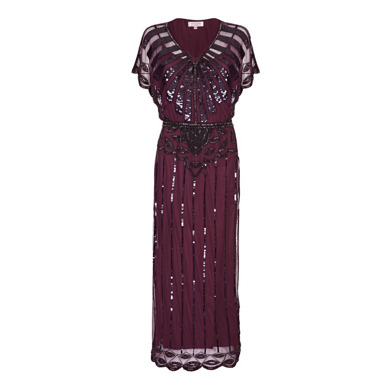 May include: A long, burgundy sequined dress with short sleeves and a V-neckline. The dress is decorated with black sequins and beads in a geometric pattern.