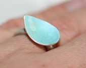 Sterling silver leaf ring with a turquoise blue enamel