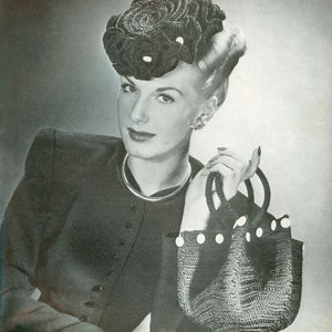 May include: A woman wearing a black crocheted hat with white beads and a black crocheted handbag with white beads.