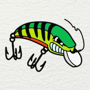 May include: A green and black fishing lure with a red mouth and a white eye. The lure has three hooks and a line attached to it.