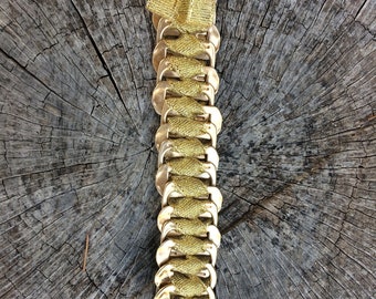 Bracelet made from recycled can capsules