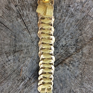 Bracelet made from recycled can capsules