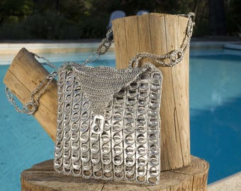 Pouch made from recycled can capsules