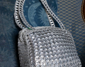 handbag made from recycled can capsules.