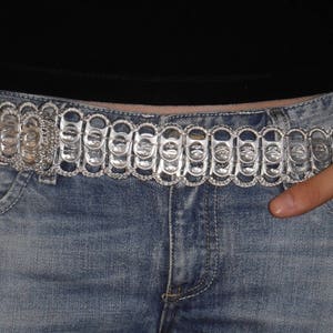 Belt made from recycled can capsules