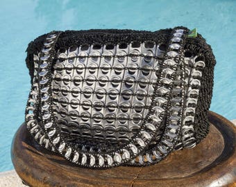 Handbag in recycled can capsules