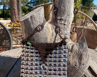 Flap-fronted pouch made from recycled can tabs