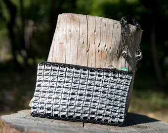 Evening clutch made from recycled can capsules