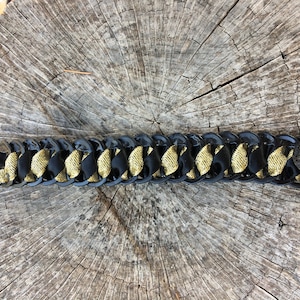 Bracelet made from recycled can capsules