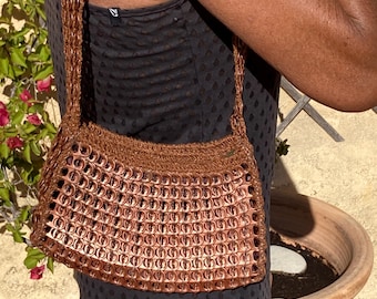 Handbag made from recycled can capsules