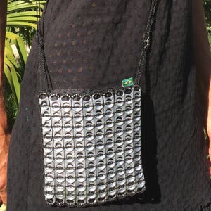Pouch made from recycled can capsules