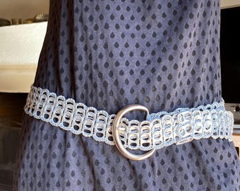 Belt made from recycled can capsules