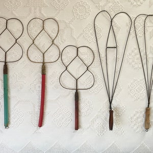 antique wooden rug beater