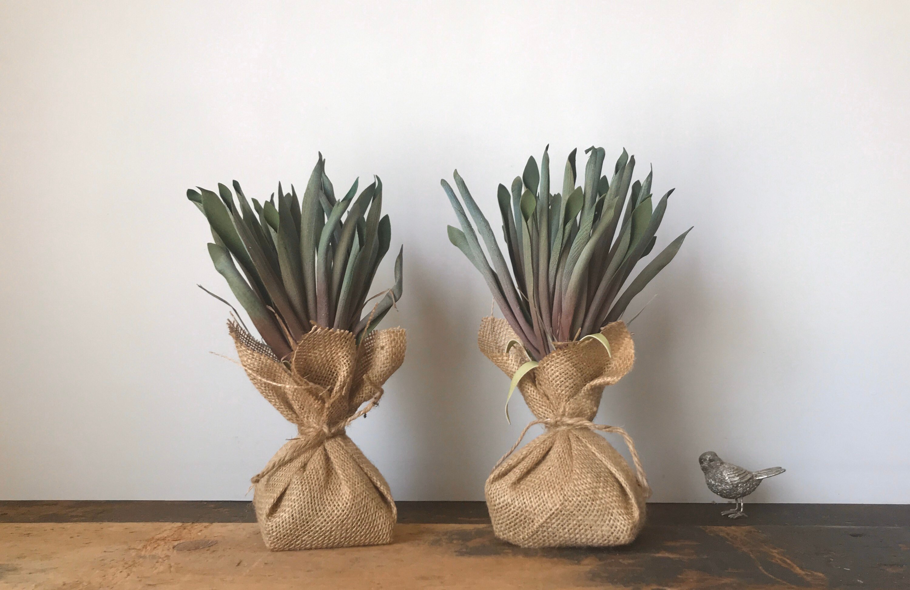 artificial faux plant wrapped in burlap