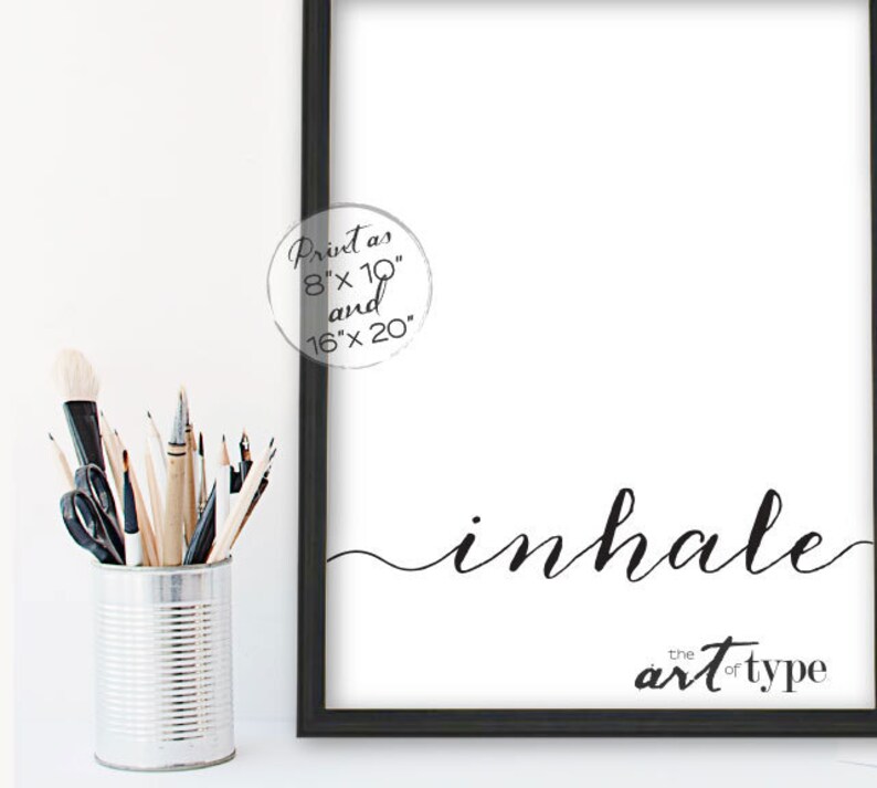 May include: Black and white printable wall art featuring the word "inhale" in a cursive font. The text is accompanied by the phrase "the art of type". The print is available in 8x10 inches and 16x20 inches.