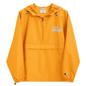 May include: A yellow Champion brand windbreaker jacket with a zipper closure and a small white graphic of a car on the front. The jacket has a hood and a kangaroo pocket.
