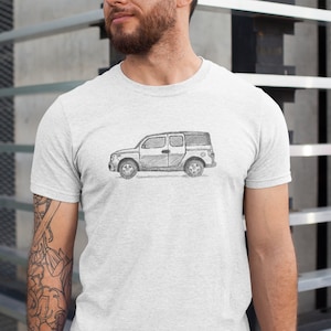 May include: A white t-shirt with a sketch of a silver SUV on the front.