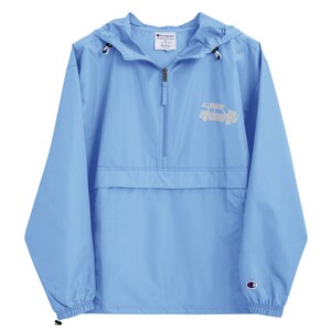 May include: A light blue Champion windbreaker with a white embroidered design of a car on the front. The jacket has a zipper closure and a hood.