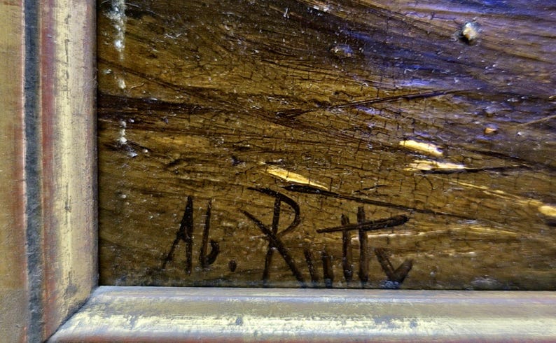 Peut inclure: Gros plan sur une peinture encadr&eacute;e &agrave; l'aspect textur&eacute; et vieilli. L'&oelig;uvre pr&eacute;sente un m&eacute;lange de teintes marron, dor&eacute;es et bleues. La signature de l'artiste, "Ab. Rutty", est visible &agrave; l'encre noire dans le coin inf&eacute;rieur gauche.