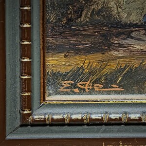 This horizontal mid-century European painting offers a beautiful pastoral scene rendered in oil on panel, showcasing skilled brushwork and balance. A true example of classic European landscapes, this signed vintage artwork enriches any farmhouse wall decor or cozy cottage space. Its timeless beauty and collectible nature make it an inspired gift idea for art appreciators, coworkers, and those seeking hand-painted decor with authentic vintage charm.