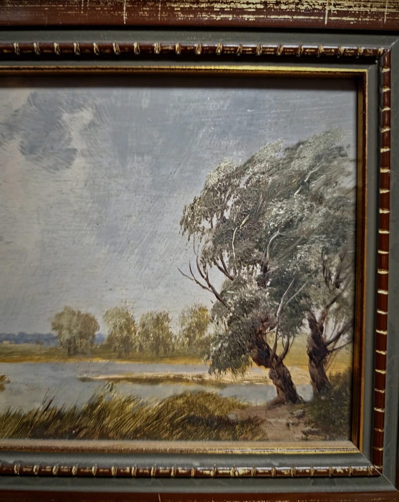 Original vintage artwork depicting a peaceful countryside scene in earthy green and brown tones, this European landscape oil painting is perfect for mid-century farmhouse decor and collectors of antique paintings for sale. Its signed authenticity, rich texture, and traditional frame make it a timeless addition to gallery walls or elegant home settings. A wonderful present for those who love rural artwork, interior design, or unique wall decorations.