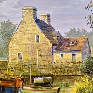 May include: Oil painting of a coastal scene featuring a stone building with a tiled roof and chimneys. Small sailboats are docked in the water, with a larger boat on the left. The painting has a warm color palette with yellow, brown, and blue hues.