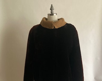 May include: A brown faux fur jacket with a brown knit collar.