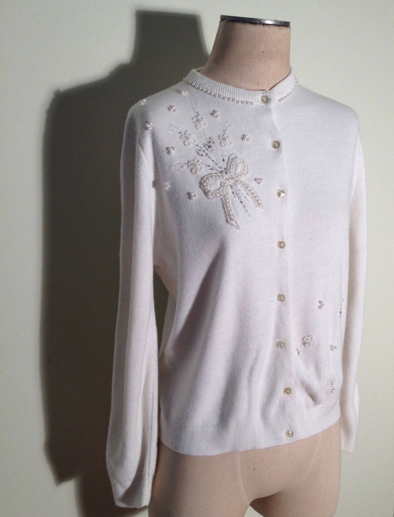 white cardigan sweater with buttons
