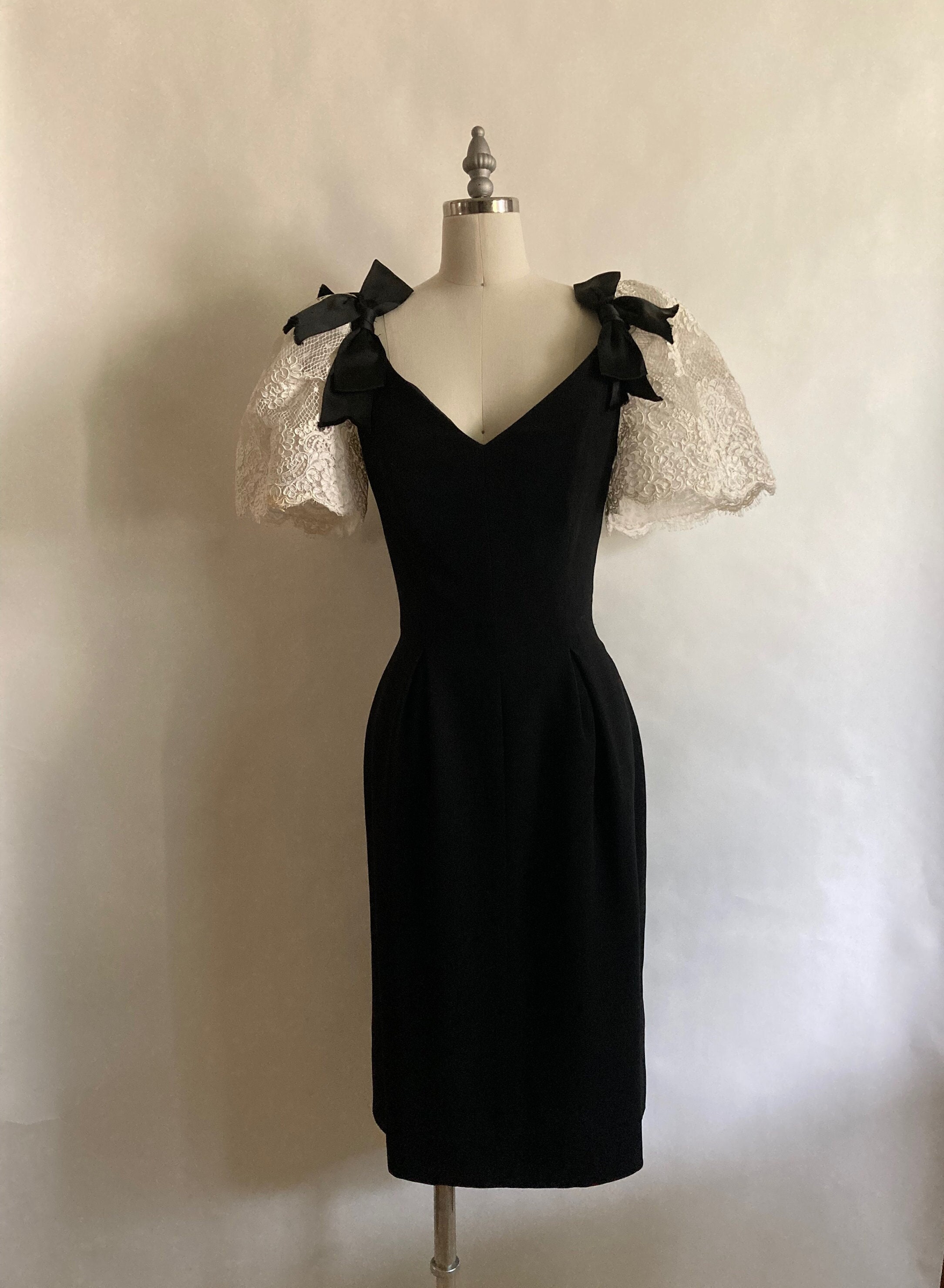 Resort 1990 Christian Dior Fitted Black Cocktail Dress with Large White Lace Puff Sleeves and Plunging V Neckline