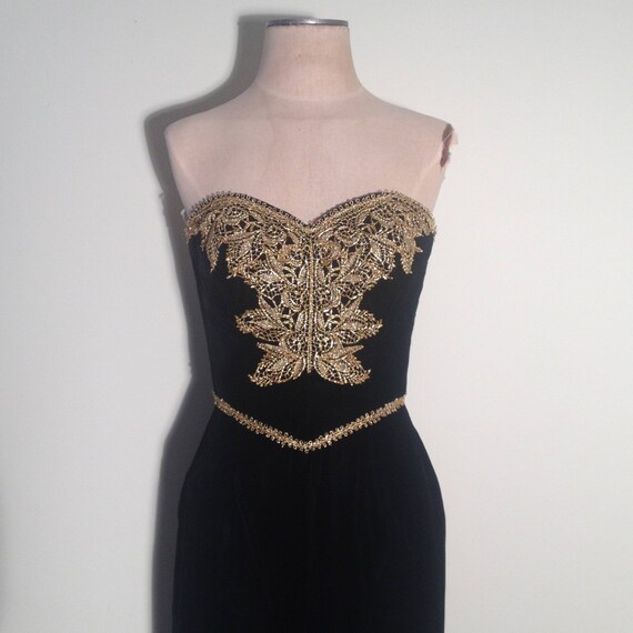 black dress with gold applique