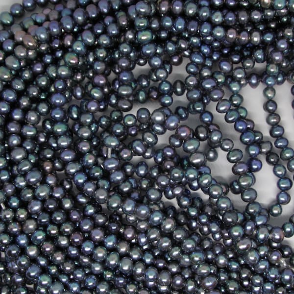 8-9mm #403 lightly ringed semi rounds peacock , large hole freshwater pearls