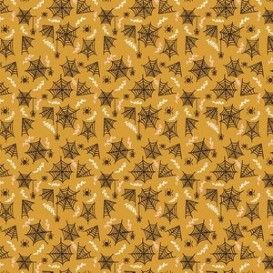 May include: A seamless pattern featuring black spiderwebs and small black spiders on a mustard yellow background. The pattern also includes small white and pink floral sprigs.