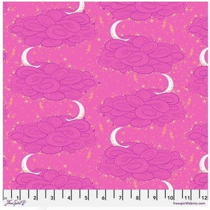May include: Pink fabric with a repeating pattern of stylized pink clouds, white crescent moons, yellow lightning bolts, and small yellow stars. The fabric has a ruler along the bottom edge with the text "Free Spirit" and "freespiritfabrics.com".