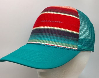 Beachy stripe on teal trucker cap.