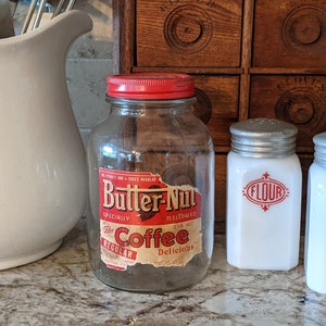 Butternut Coffee Jar Collectible Glass Container Coffee Station Cart Farmhouse Retro Red Label Lid Butter Nut Omaha Nebraska Paxton history