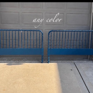 May include: Two matching dark blue bed headboards featuring a spindle design with a series of vertical twisted columns and a solid horizontal base rail. The text "any color" is visible in white script lettering centered above the headboards.