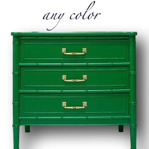 May include: A green three-drawer chest with bamboo-style detailing. The chest has gold-colored handles and the text "any color" in cursive script above it. The chest is painted in a vibrant green color.