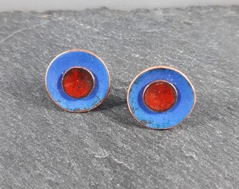 Ultramarine blue and burnt orange duo enamel stud earrings.