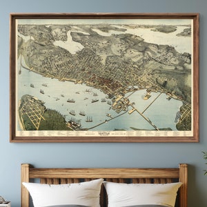 May include: A vintage map of Seattle, Washington, showing the city's layout and surrounding waterways. The map is printed in a detailed style with a brown frame.
