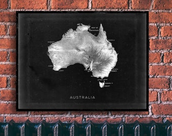 May include: A black and white topographic map of Australia with the country name "AUSTRALIA" printed at the bottom. The map shows the major cities and geographic features of the country.