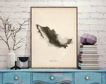 May include: A black and white print of a map of Mexico with the word "MEXICO" printed below the map. The print is framed and hanging on a white brick wall above a blue dresser.